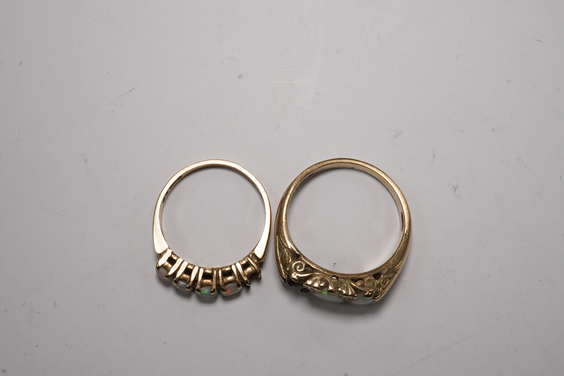 Two 9ct gold and opal cluster set rings, stones missing, gross weight 6.7 grams, Condition - poor